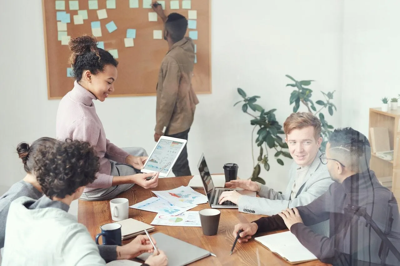 A team discuss research in a boardroom