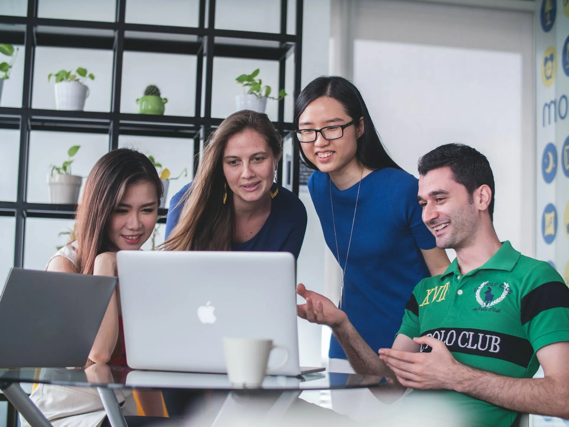 Group of people look at a computer screen