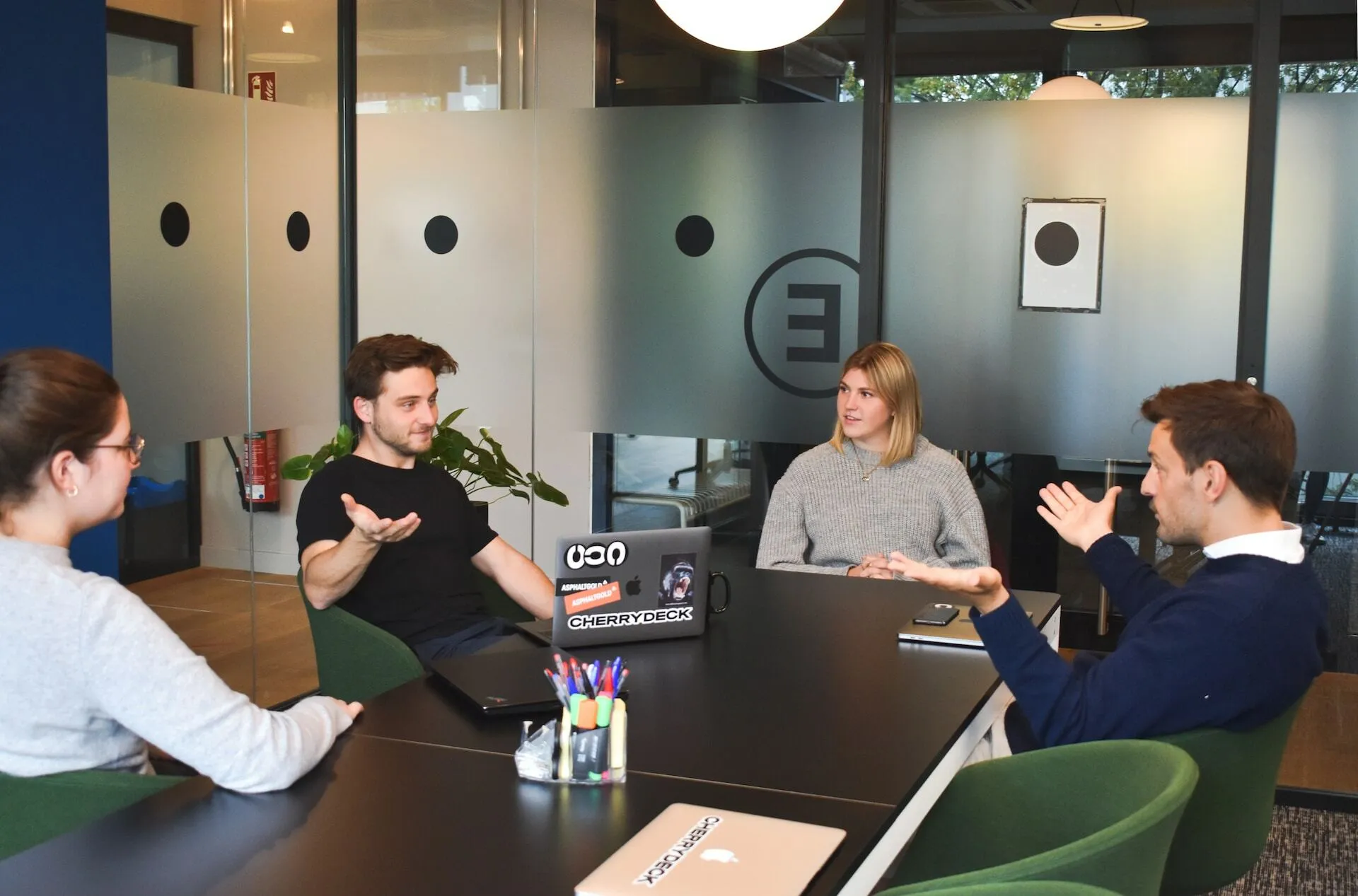 People discuss in a boardroom