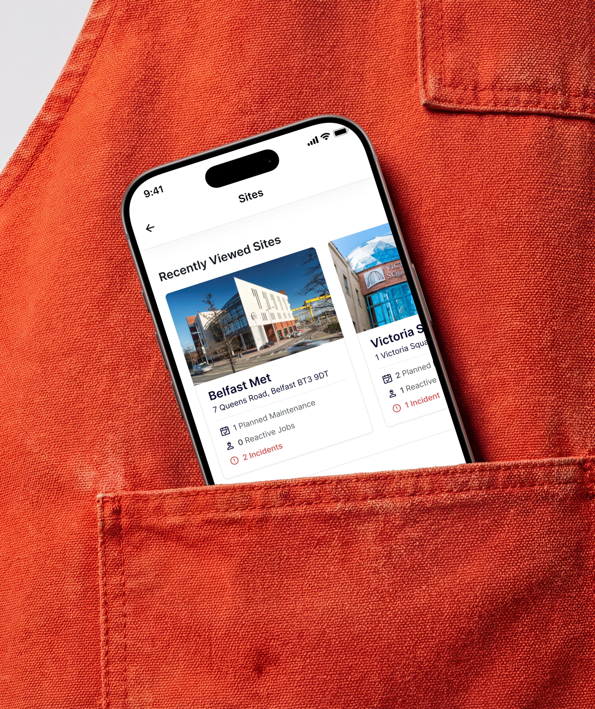 Phone in a pocket showing a building list app