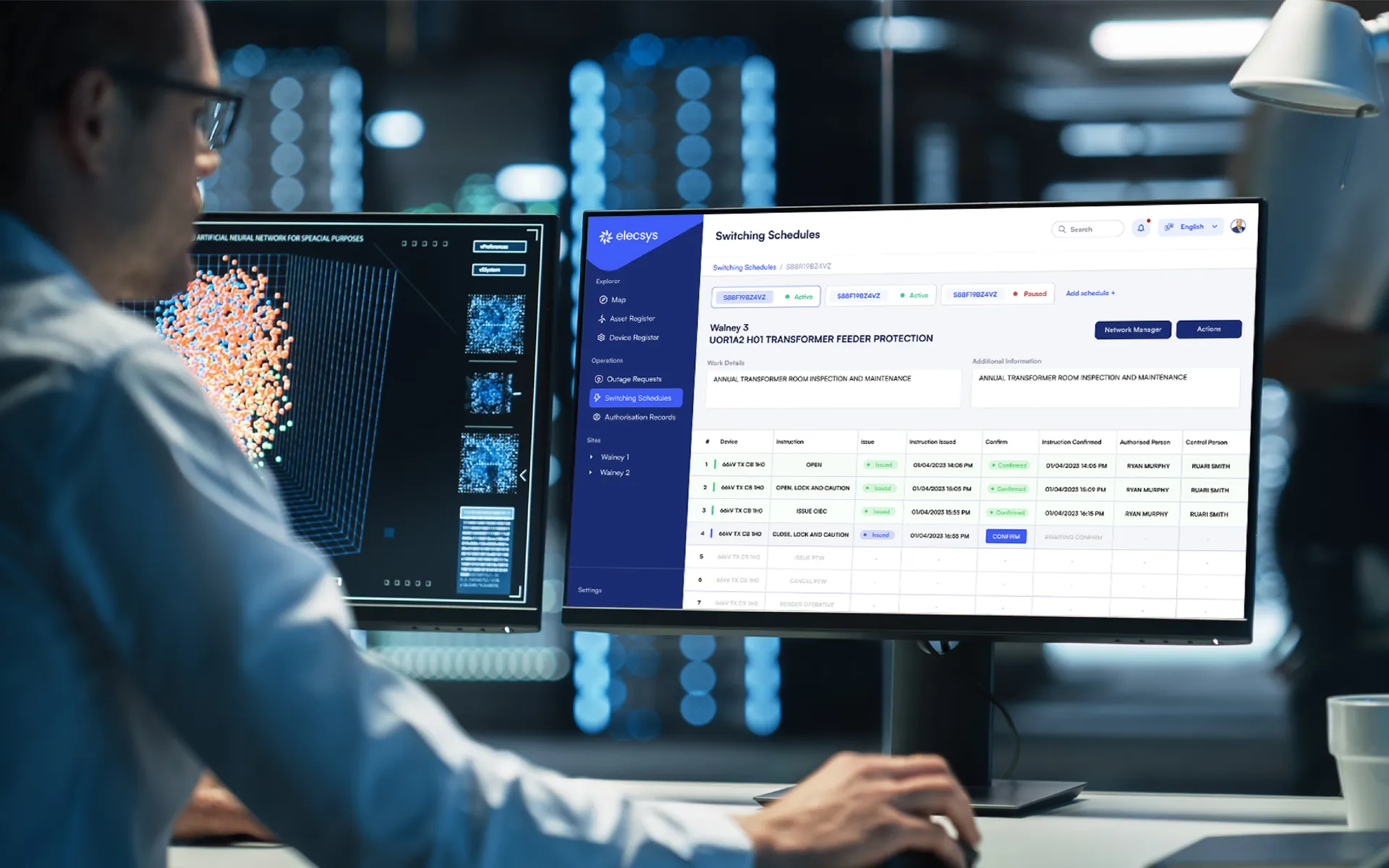 Person at a large monitor running a data-heavy web dashboard