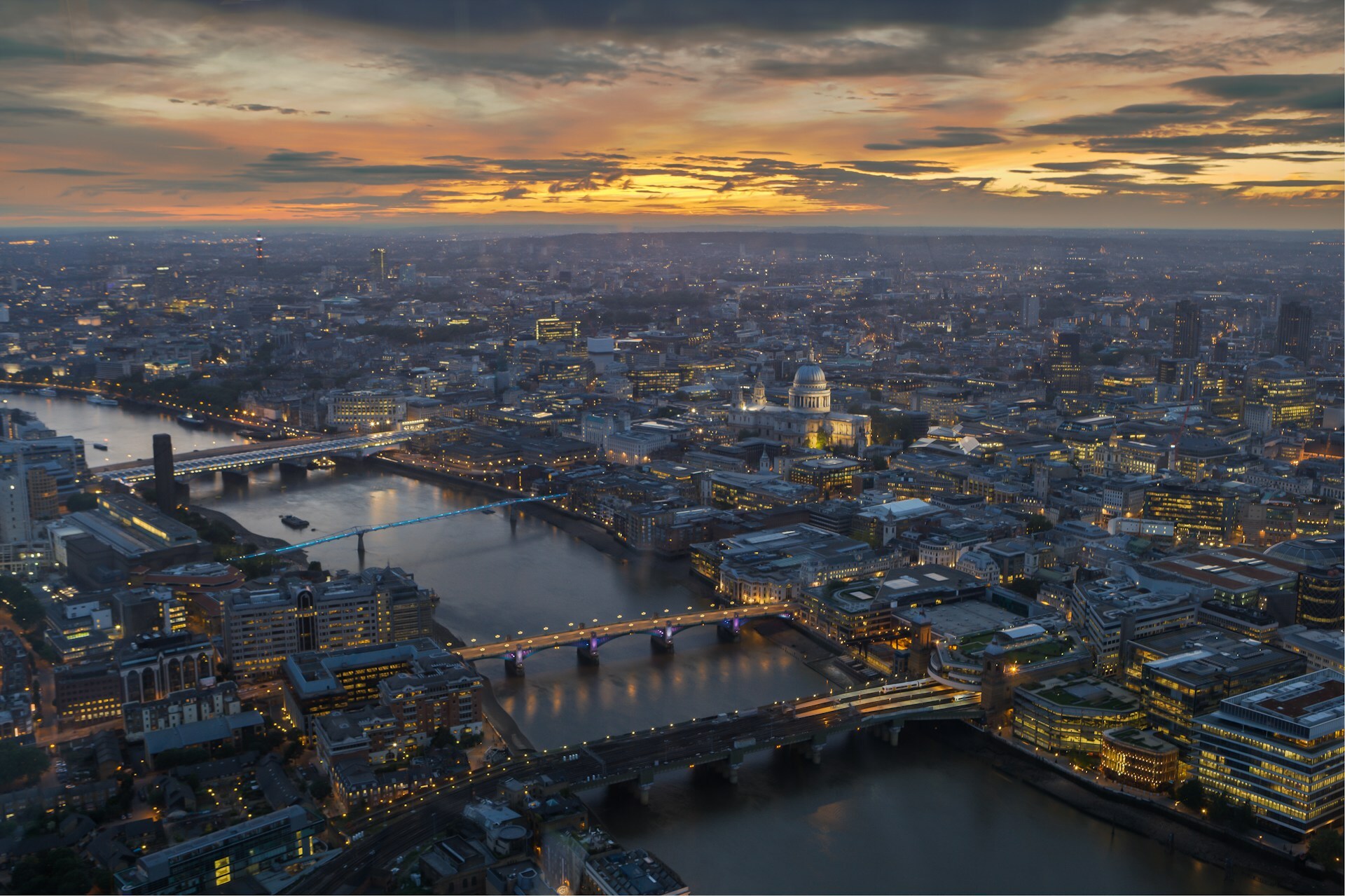 Aerial of London at dusk with the Thames