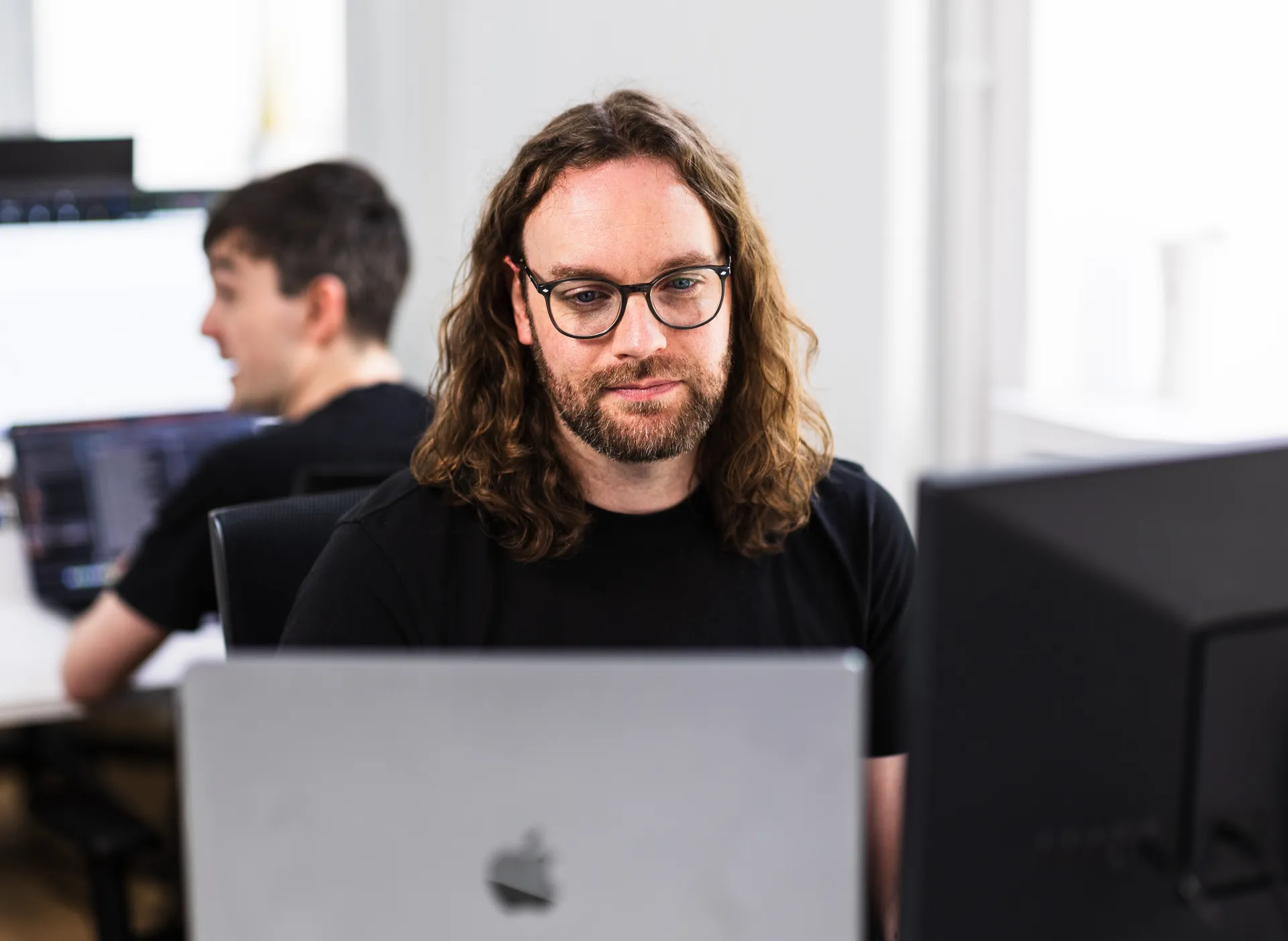Myth Digital's in-house development team collaborating on a web application project