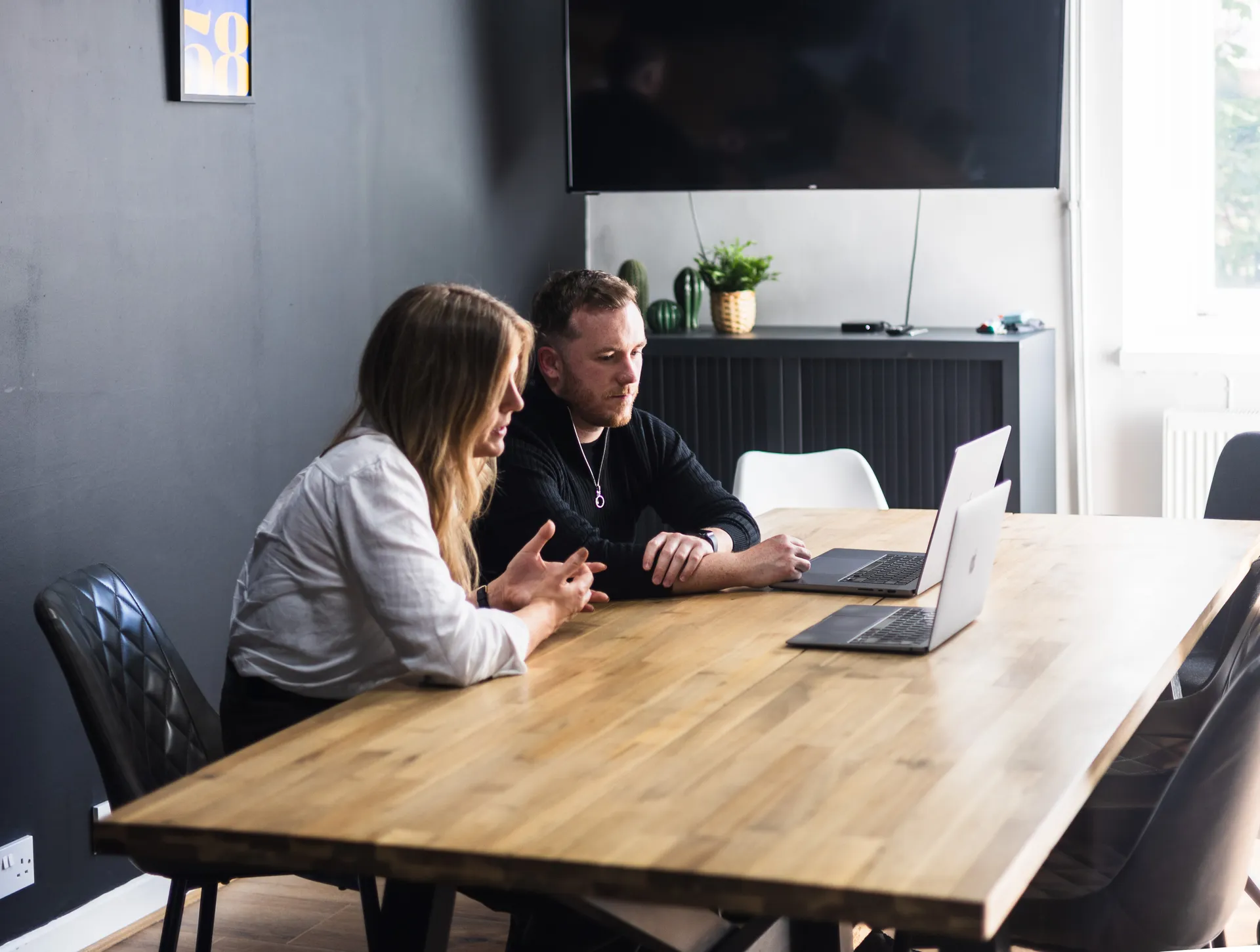 Two Myth team members in conversation