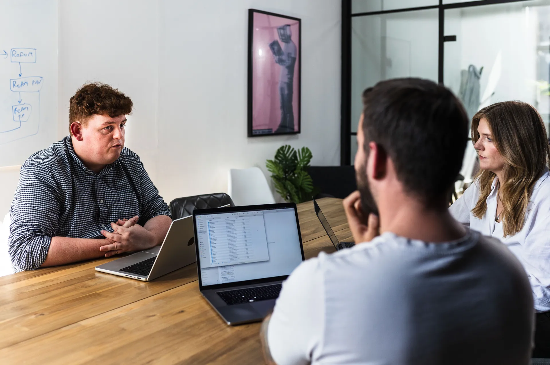 Meeting with a spreadsheet open on a laptop