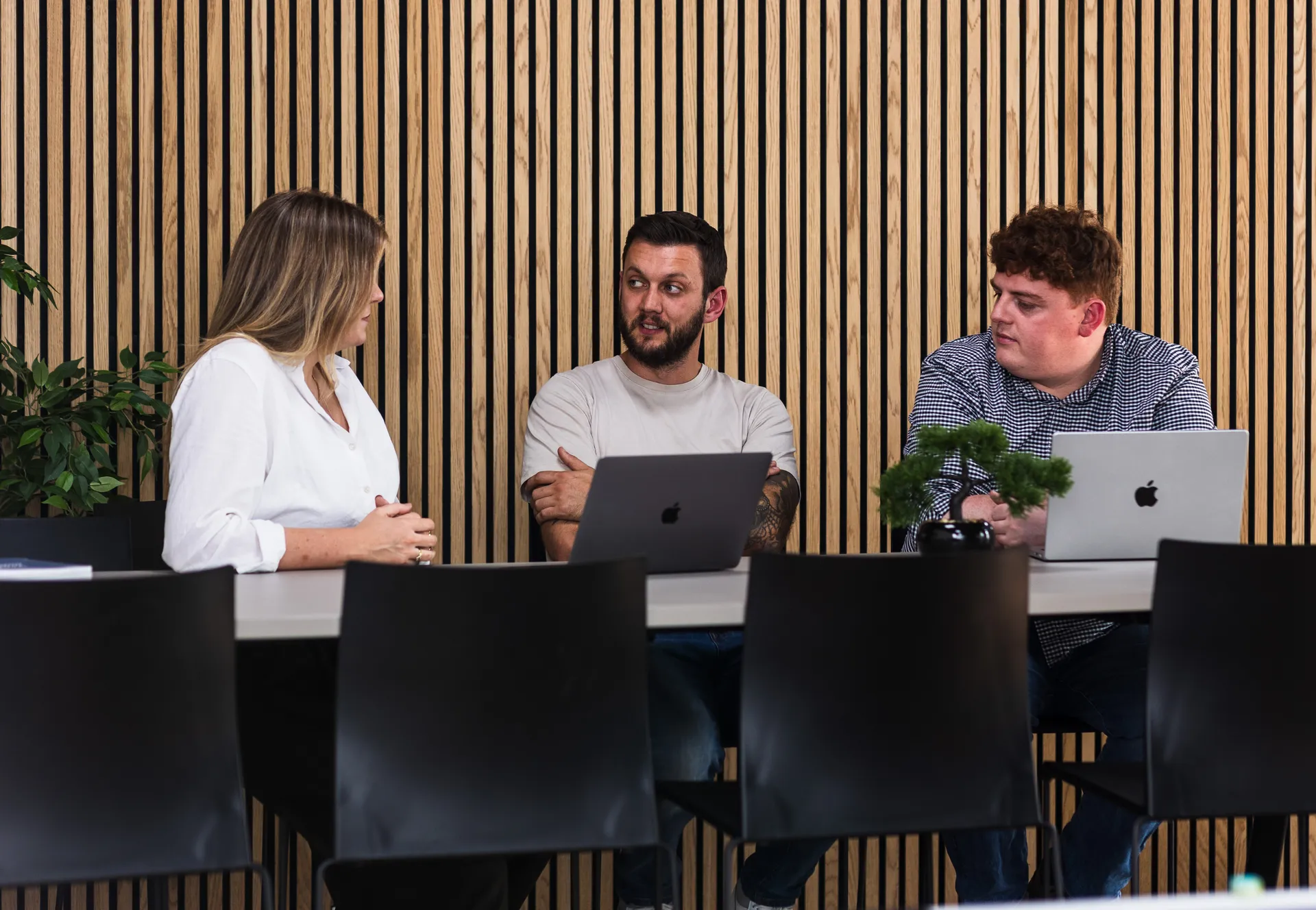 Myth Digital's senior in-house team collaborating on a web design project at their Belfast office